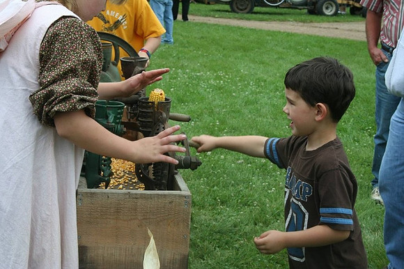 Aiden shelling corn